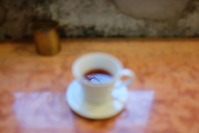 Close-up of coffee cup on table