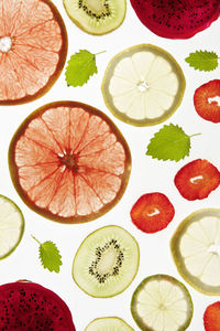 Fruit slices on white background