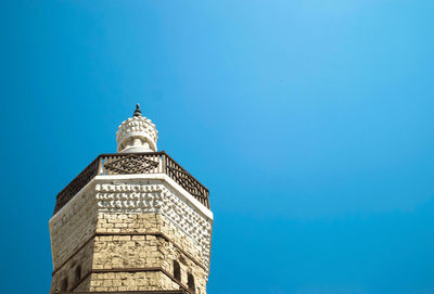 Low angle view of building against clear blue sky