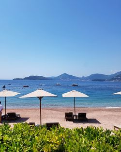 Scenic view of beach against clear sky