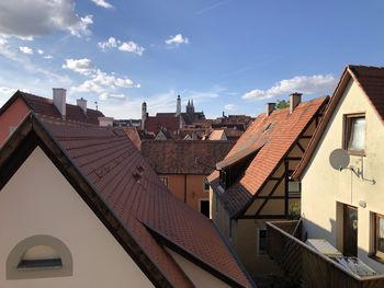 Houses in town against sky