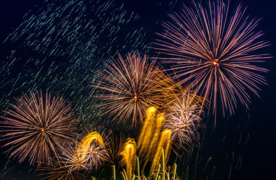 Low angle view of sky illumed with fire crackers