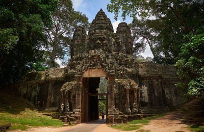 Statue in temple against sky