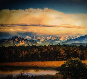 Scenic view of lake against sky during sunset