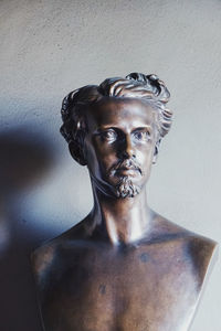 Portrait of young man against wall