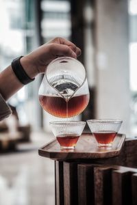 Close-up of hand holding drink