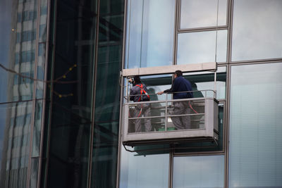 Men working in balcony