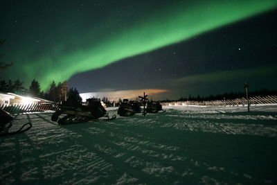 Panoramic view of illuminated road against sky at night