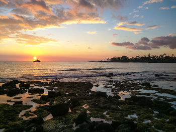 Scenic view of sea at sunset