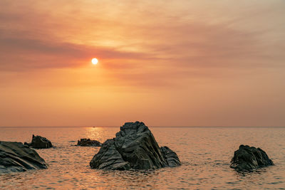 Scenic view of sea against sky during sunset