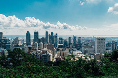 Modern buildings in city against sky