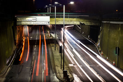 Light trails on road in city at night