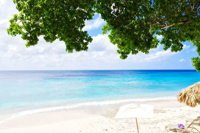 Scenic view of calm sea against cloudy sky