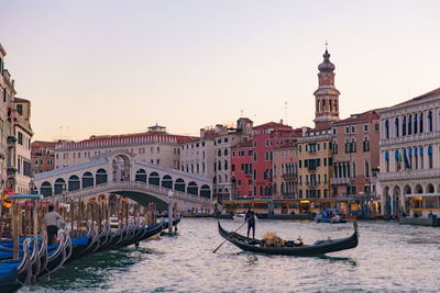 View of canal passing through city buildings