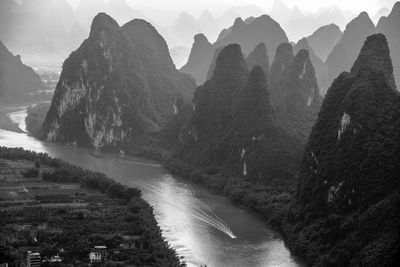 Panoramic view of river and mountains against sky