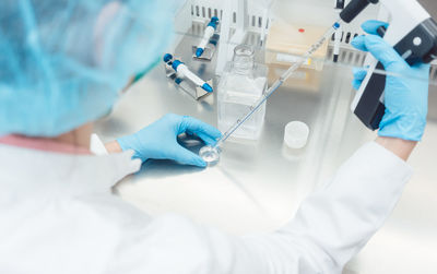 High angle view of scientist working in laboratory