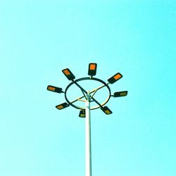 Low angle view of street light against clear blue sky