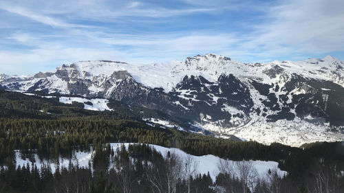 Scenic view of snowcapped mountains against sky