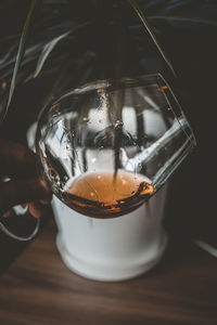 Close-up of coffee in glass on table