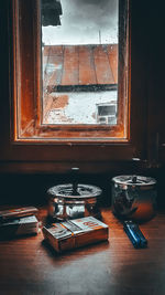 Close-up of glass window on table at home