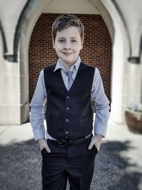 Portrait of boy standing outdoors