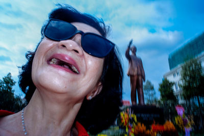 Portrait of young woman wearing sunglasses