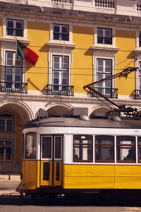 Tram against buildings in lisbon, portugal