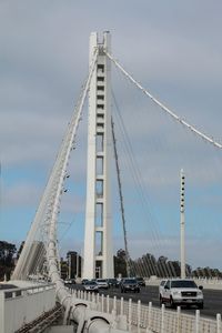 View of bridge against cloudy sky