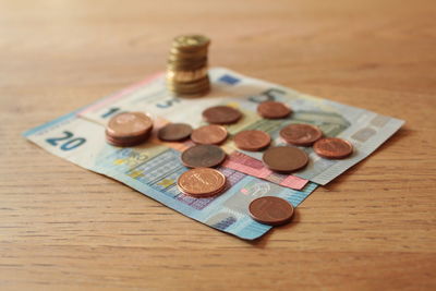 High angle view of coins on table