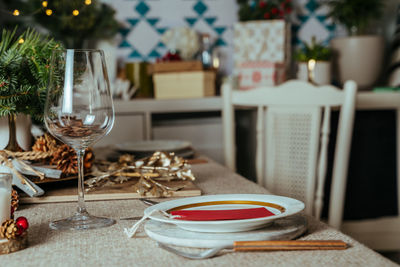  christmas table setting decorated with pine branches and rustic tablecloth . european style,