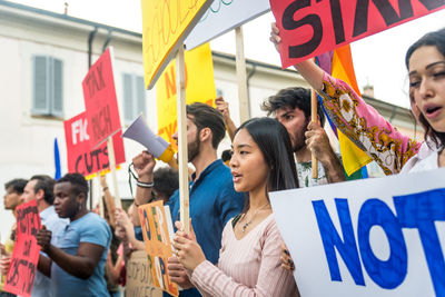 People protesting while standing on land