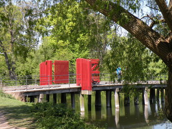 Wooden structure by trees in park