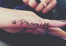 Cropped image of hand holding ring