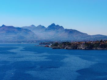 Scenic view of sea against blue sky