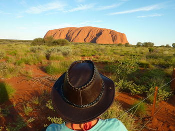 Scenic view of rocks on field against sky