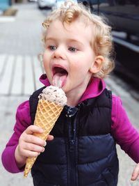 Portrait of cute boy eating ice cream