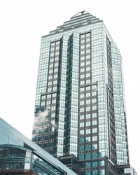 Low angle view of modern building against clear sky