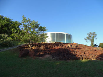 Built structure on field against clear sky