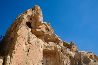 Low angle view of historical building against blue sky