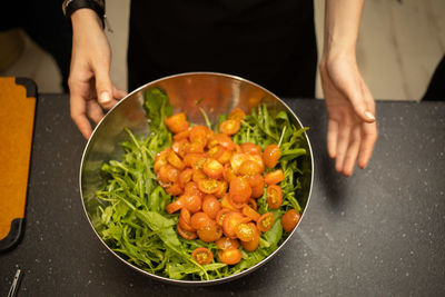 Midsection of man preparing food in kitchen