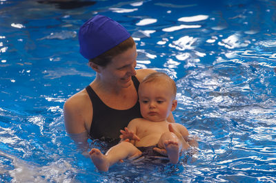 Portrait of boy swimming in pool