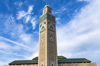 Low angle view of clock tower against sky