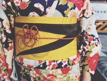 Close-up mid section of woman in traditional japanese dress