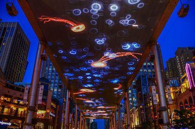 Low angle view of illuminated buildings at night