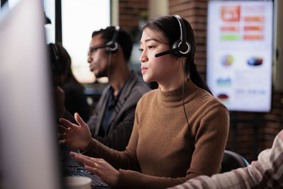 Customer service representative talking through headset