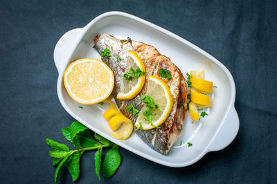 High angle view of fish served in plate on table