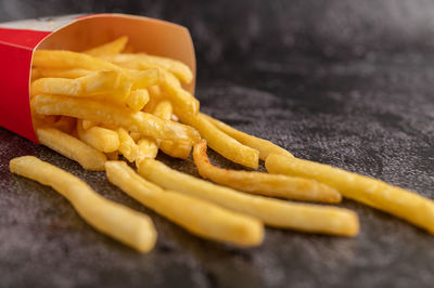 High angle view of meat and fries on table