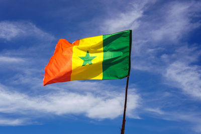 Low angle view of flag against sky