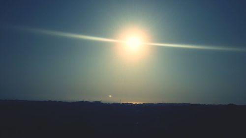 Silhouette of landscape against clear sky