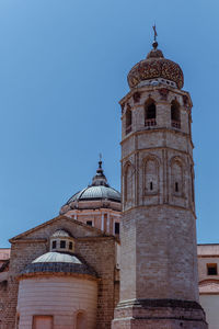 Low angle view of historic building against clear sky